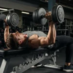 Dumbbell Training Guide: Free Weight Science, Muscle Activation Research, and 10 Essential Exercises person performing dumbbell bench press correct form neutral grip flat bench gym strength training photography