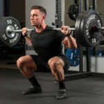 person performing paused squat barbell bottom position dead stop isometric hold strength training