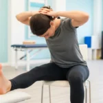 Nerve Flossing: The Neural Mobilisation Technique That Relieves Sciatica, Radiating Arm Pain, and Neural Tension person performing sciatic nerve flossing seated neural mobilisation knee extension cervical flexion technique
